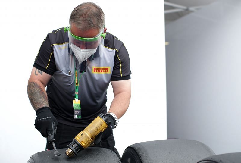 Pirelli tyre technician working on tyres at Spielberg in Austria. Photo: Peter Fox/Getty Images.