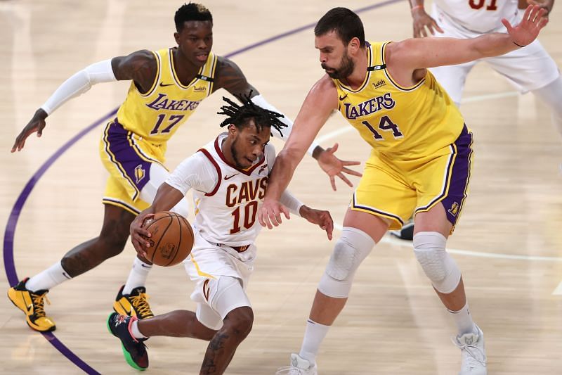 Marc Gasol #14 defends against the dribble of Darius Garland #10