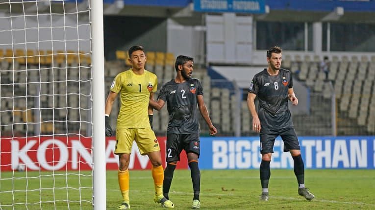 FC Goa&#039;s Sanson Pereira pats Dheeraj Singh on the back after the latter saves a penalty for FC Goa (Image Courtesy: AFC website)