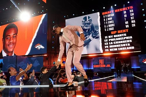 2Alabama cornerback Patrick Surtain II walks onto the NFL Draft stage after being selected ninth overall by the Denver Broncos on April 29, 2021.