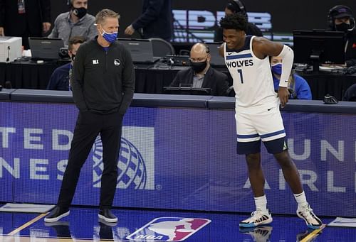 Steve Kerr speaks to Anthony Edwards #1 when he checks in for their game 