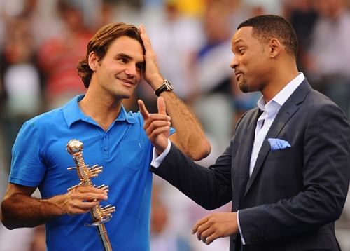 Roger Federer poses with the Madrid trophy in 2012