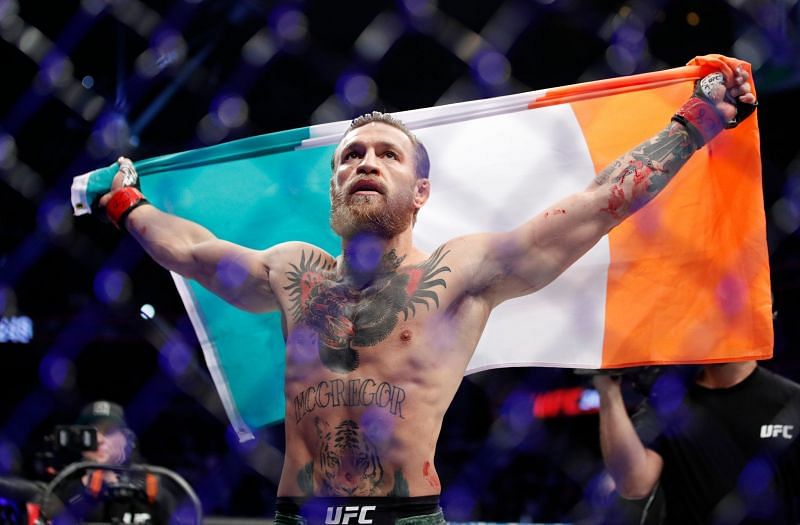 Conor McGregor holds up the Irish flag