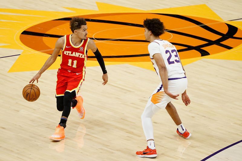 Trae Young #11 (left) of the Atlanta Hawks