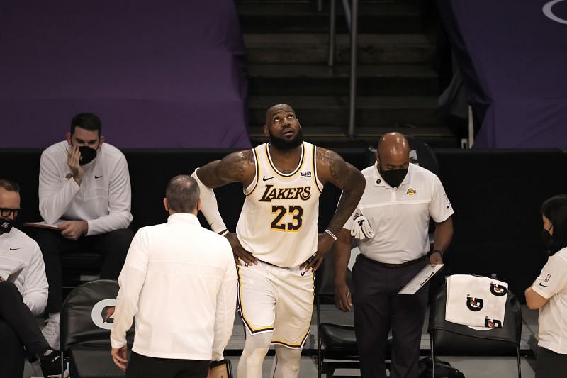 LA Lakers leader LeBron James watches on after getting injured against Atlanta