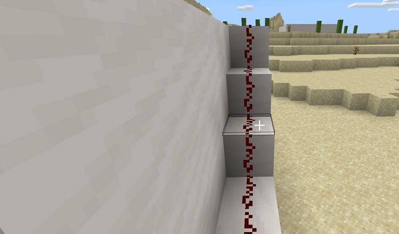 Once the connection has been made, you will make a set of stairs using blocks that you will use to extend the trail of Redstone dust all the way to the roof of your house.