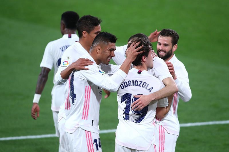 Real Madrid players celebrate a goal against Cadiz CF.