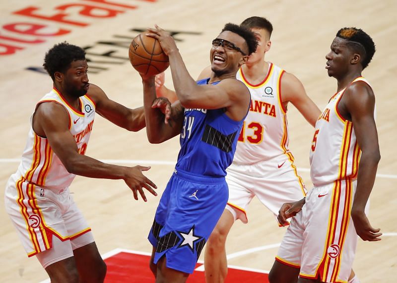 Wendell Carter Jr. #34 is fouled by Solomon Hill #18.