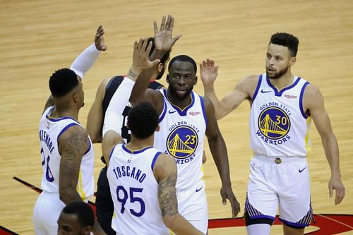 Warriors players celebrate a win