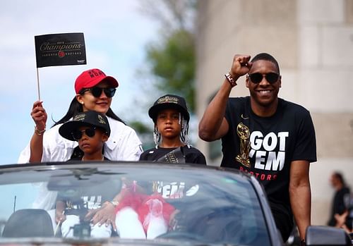 Toronto Raptors President Masai Ujiri and family wave during the Toronto Raptors Victory Parade on June 17, 2019, in Toronto, Canada