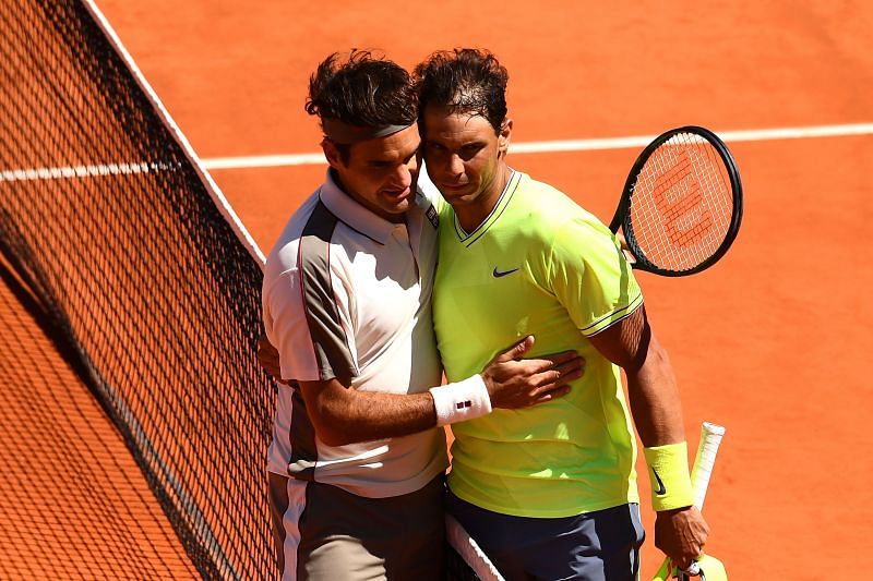 Roger Federer and Rafael Nadal embrace at the 2019 French Open