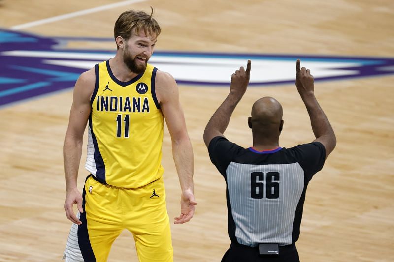 Domantas Sabonis #11 reacts as referee Haywoode Workman #66 makes a call