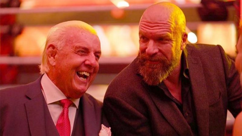 Ric Flair (16-time World Champion) and Triple H (14-time World Champion)