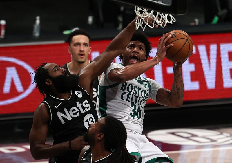 Marcus Smart #36 of the Boston Celtics shoots against James Harden #13 of the Brooklyn Nets