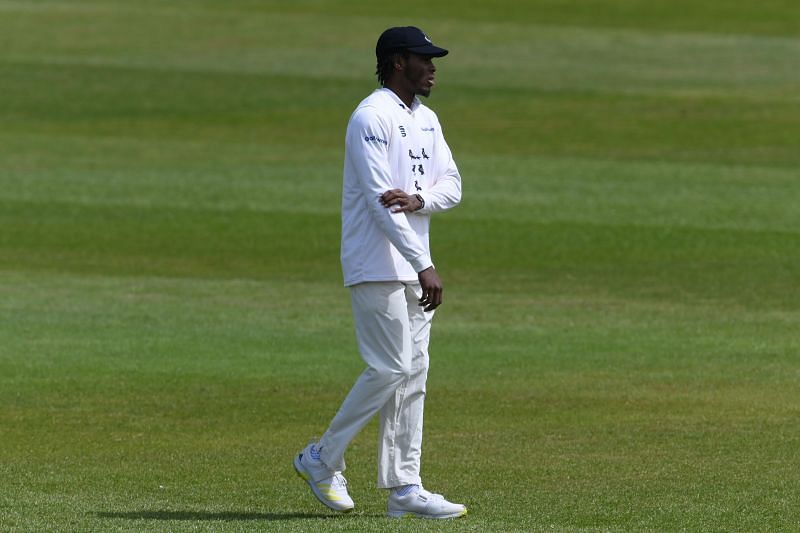 Jofra Archer feels his right elbow during the County Championship match against Kent