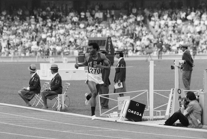 Lee Evans during 4x400 relay team event at the Mexico Olympics.