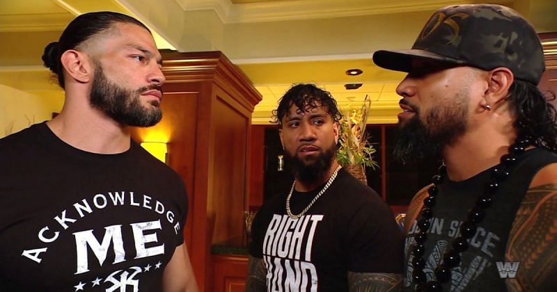 Roman Reigns and The Usos.