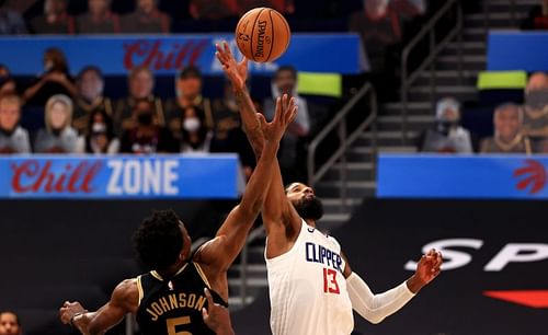 LA Clippers' Paul George battles for jump-ball