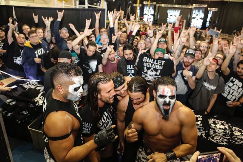 Adam Cole with the Bullet Club and their fans