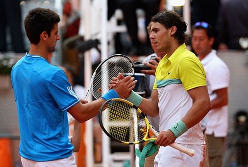 Novak Djokovic and Rafael Nadal embrace after their 2009 Madrid semifinal