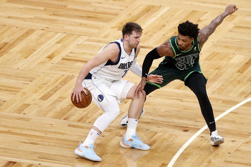 Marcus Smart #36 defends Luka Doncic #77