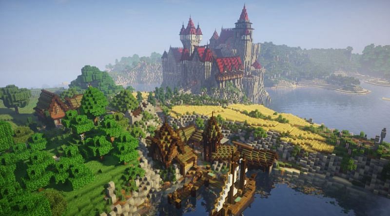 A beautiful castle in Minecraft with a smaller town nearby (Image via u/fWhipCraft on Reddit)