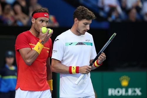 Rafael Nadal (L) and Pablo Carreno Busta