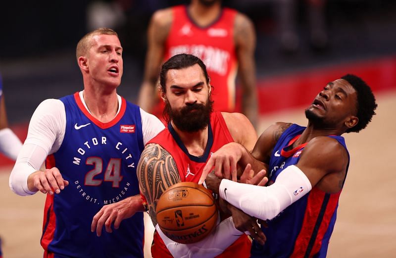 Mason Plumlee #24 of the Pistons (Left) in action