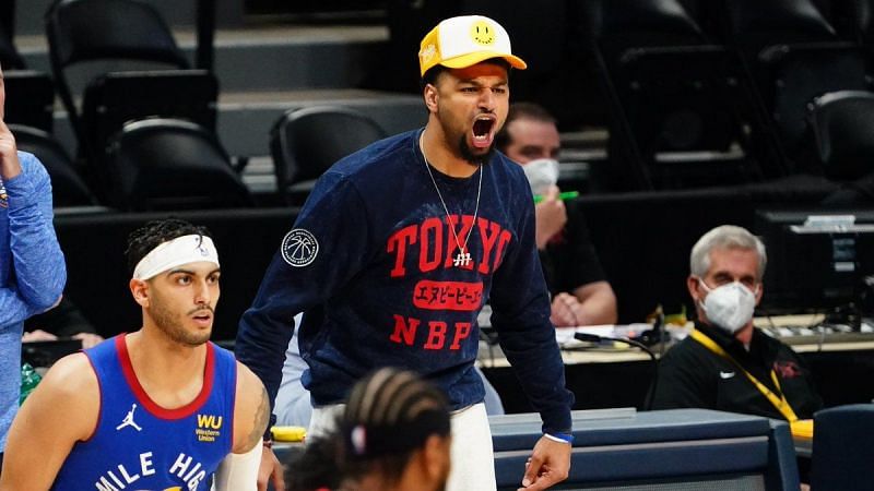 Jamal Murray on the sidelines cheering for the Denver Nuggets