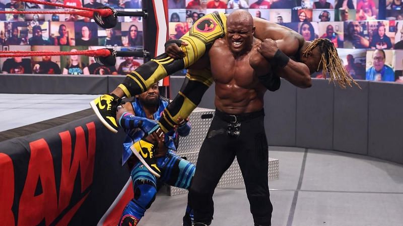 Xavier Woods assisting Kofi Kingston