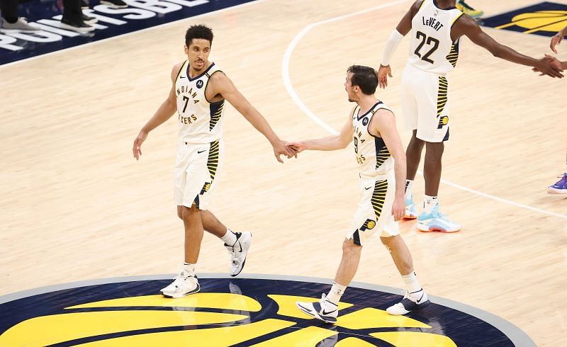 Malcolm Brogdon #7 celebrates with T.J. McConnell #9
