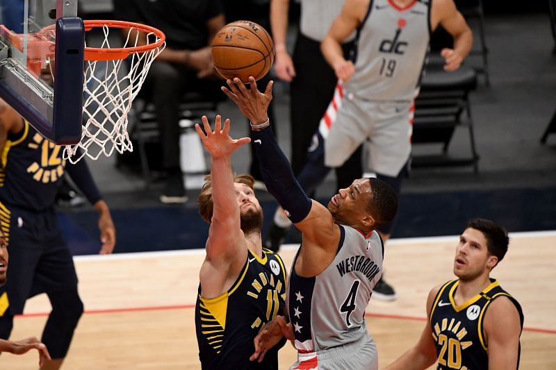 Russell Westbrook #4 shoots in front of Domantas Sabonis #11