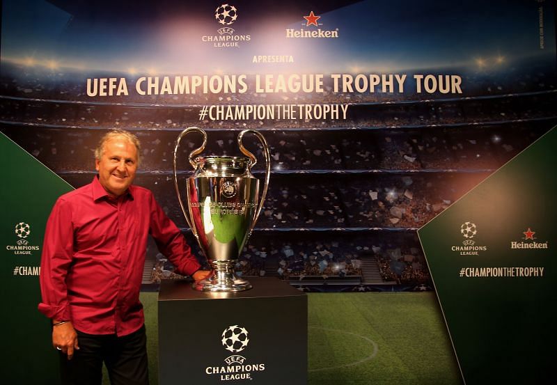 Zico poses with the Champions League trophy.