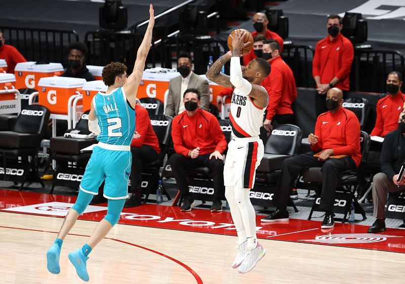 Damian Lillard #0 takes a shot against LaMelo Ball #2.