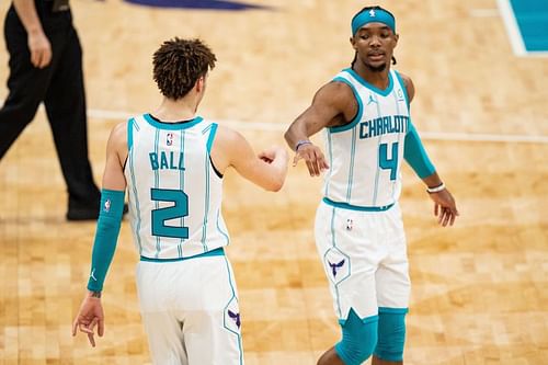 LaMelo Ball #2 and Devonte' Graham #4 congratulate each other