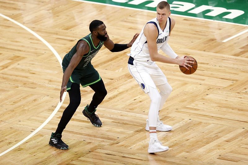 Jaylen Brown #7 of the Boston Celtics defends Kristaps Porzingis #6 of the Dallas Mavericks