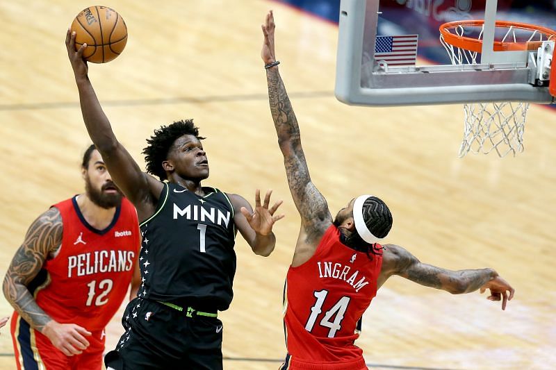 Anthony Edwards (#1) shoots over Brandon Ingram (#14).