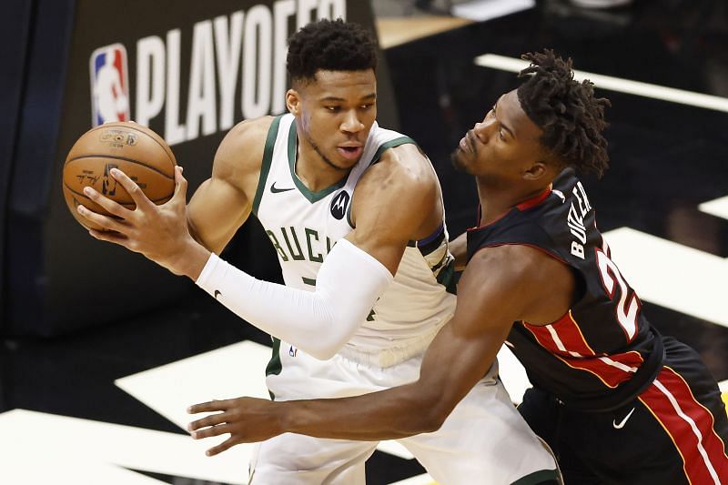 Giannis Antetokounmpo is guarded by Jimmy Butler