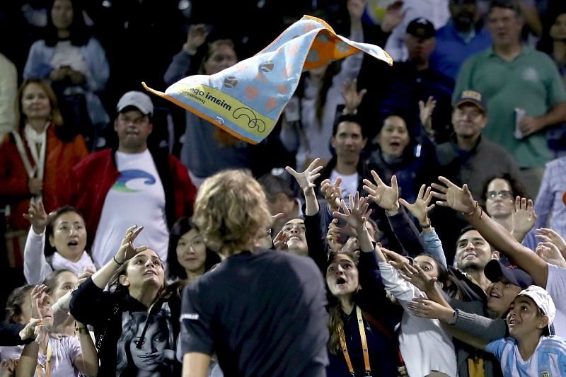 Alexander Zverev throws his towel into the audience