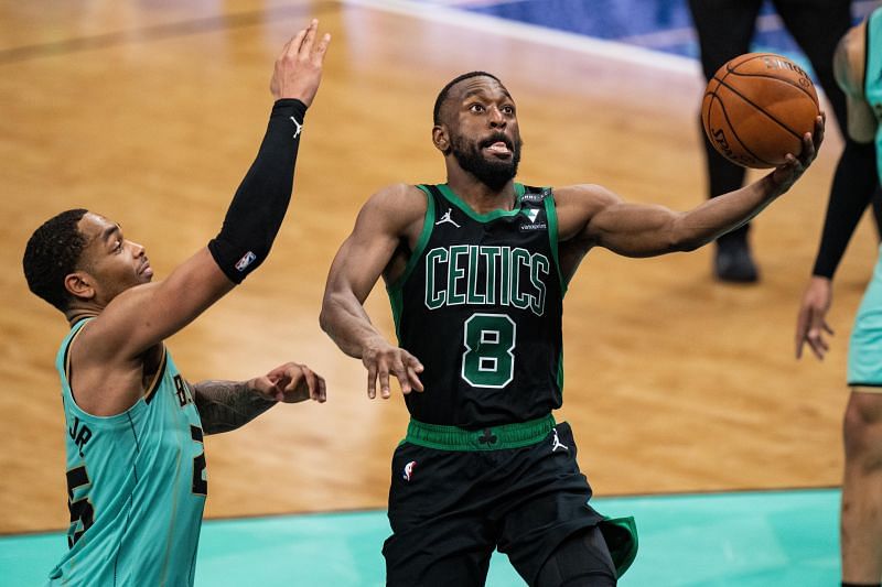 Kemba Walker #8 drives to the basket while being guarded by P.J. Washington #25