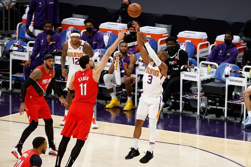 Chris Paul #3 attempts a shot over Enes Kanter #11