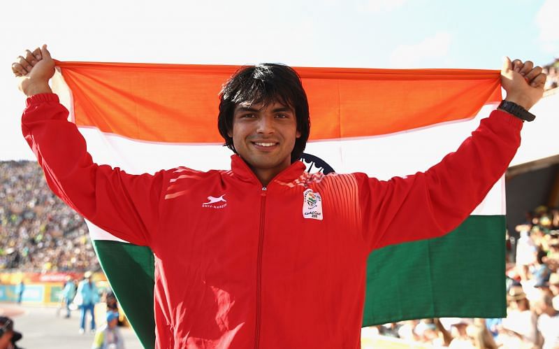 Neeraj Chopra with the Indian flag after bagging gold at the 2018 Commonwealth Games