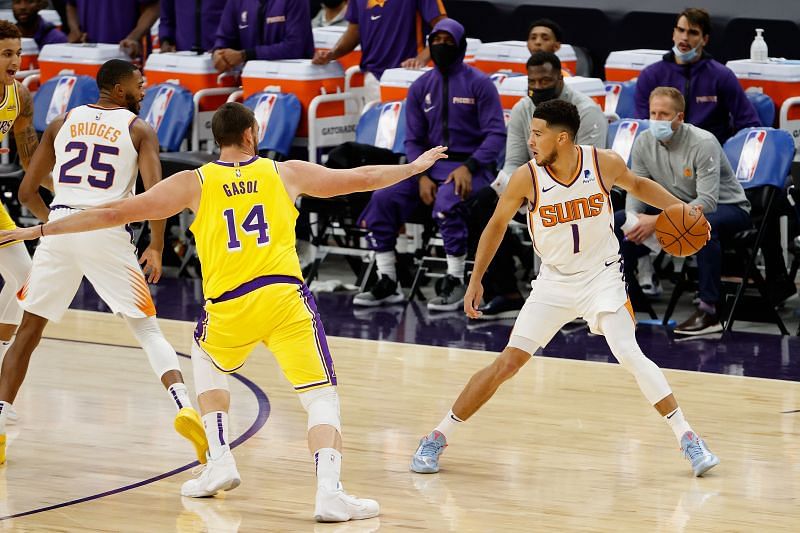 Devin Booker #1 handles the ball during the NBA preseason game