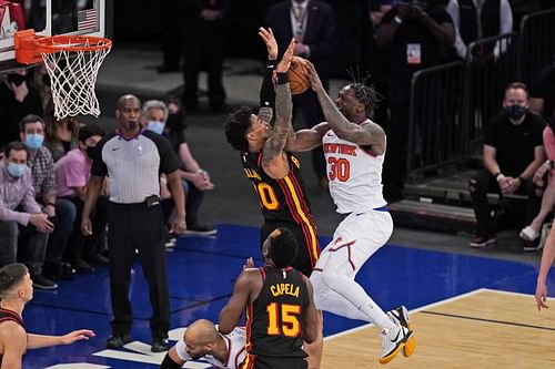 Julius Randle, right, drives to the basket during the second half of Game 1.