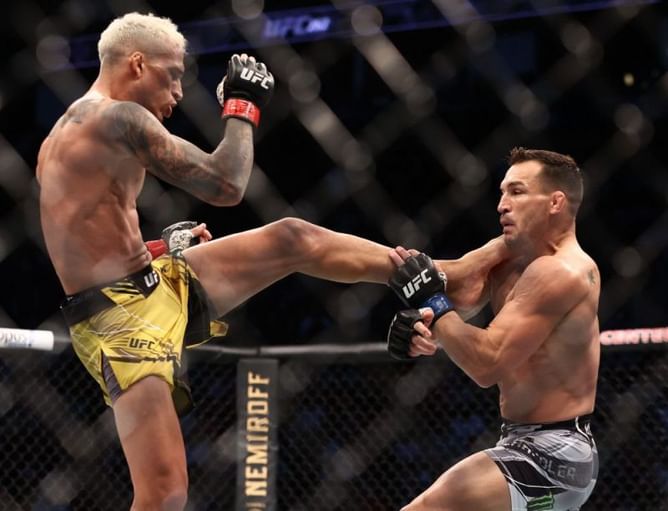 "How in the world are you scoring that 10-8?" - Daniel Cormier compares Charles Oliveira vs Michael Chandler to an infamous UFC fight