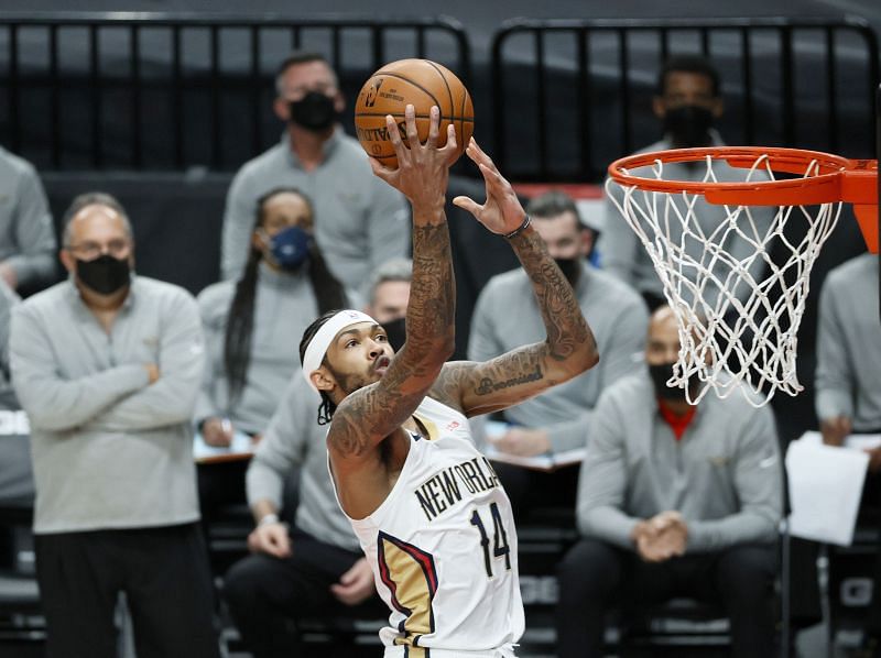 Brandon Ingram #14 shoots against the Portland Trail Blazers.