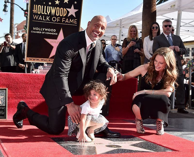 The Rock and his wife with their daughter