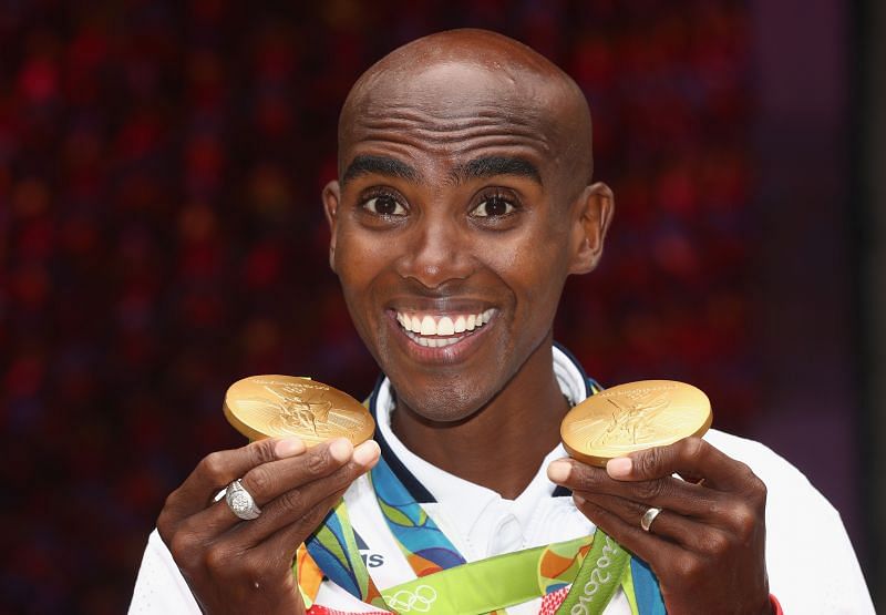Farah posing with his gold medals at the Rio Olympics