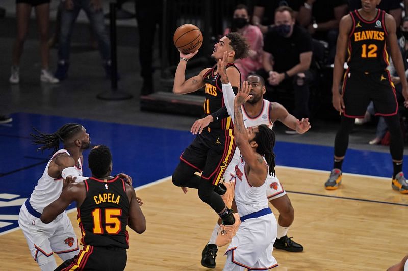 Trae Young, center, drives to the basket during the first half of Game 1.