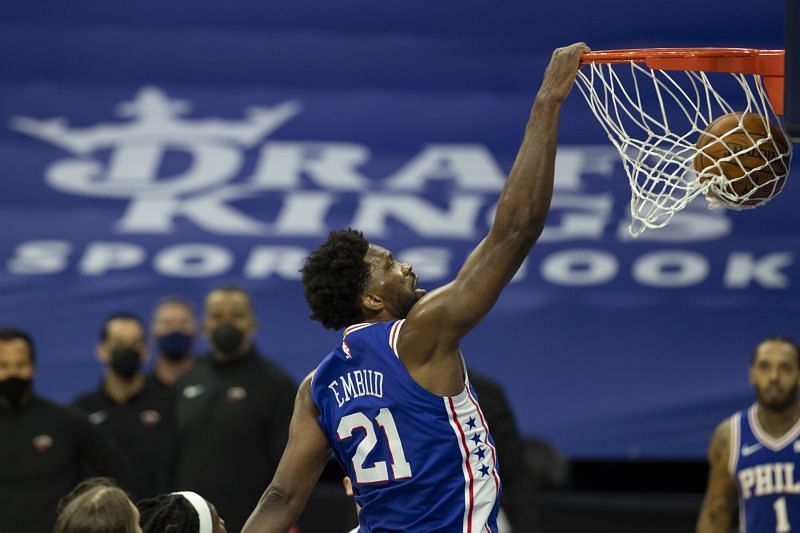 Joel Embiid goes in for a dunk.